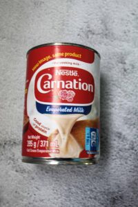 Evaporated milk + a pinch of baking soda
